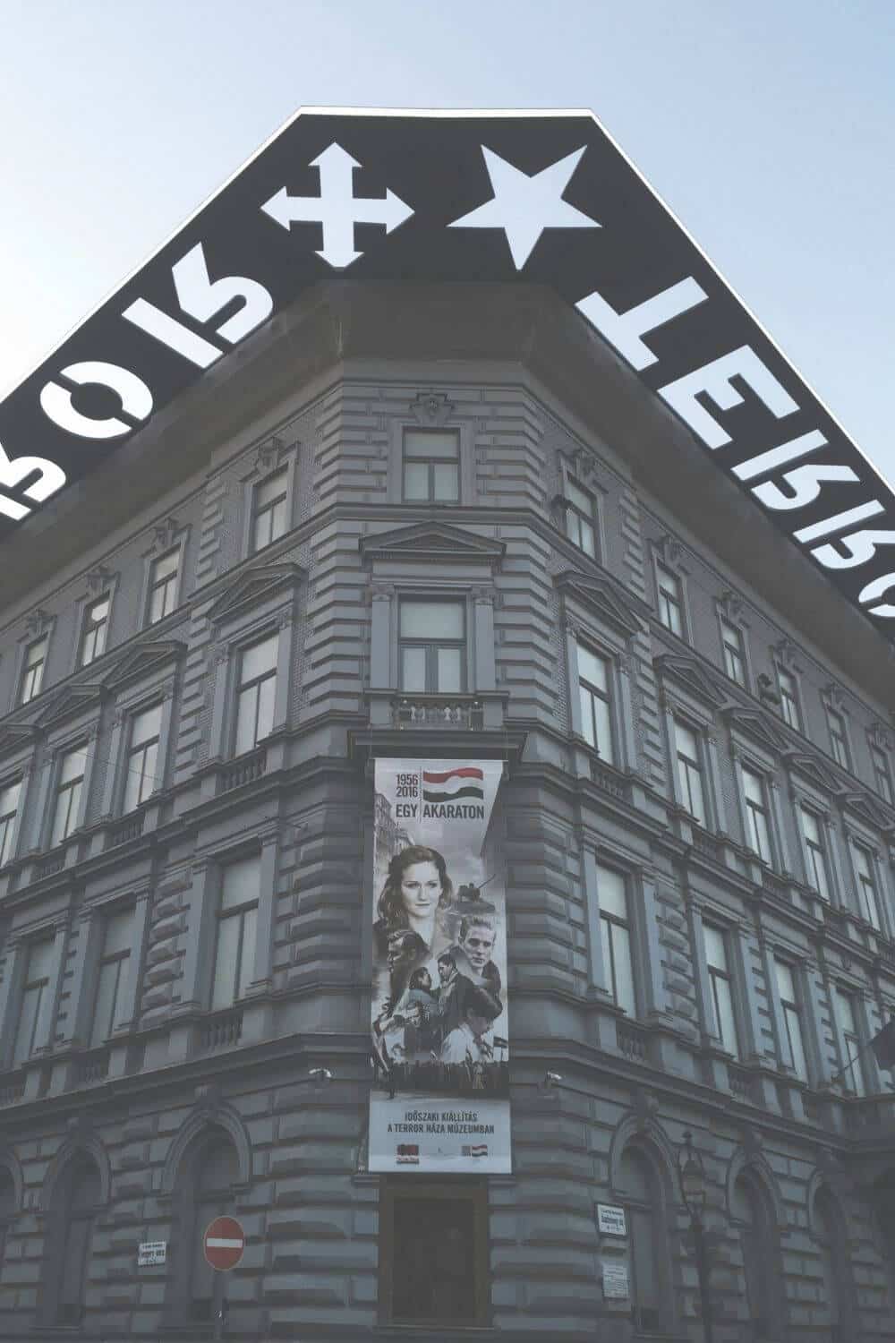 Exterior of the House of Terror museum on Andrássy Avenue with the TERROR overhang