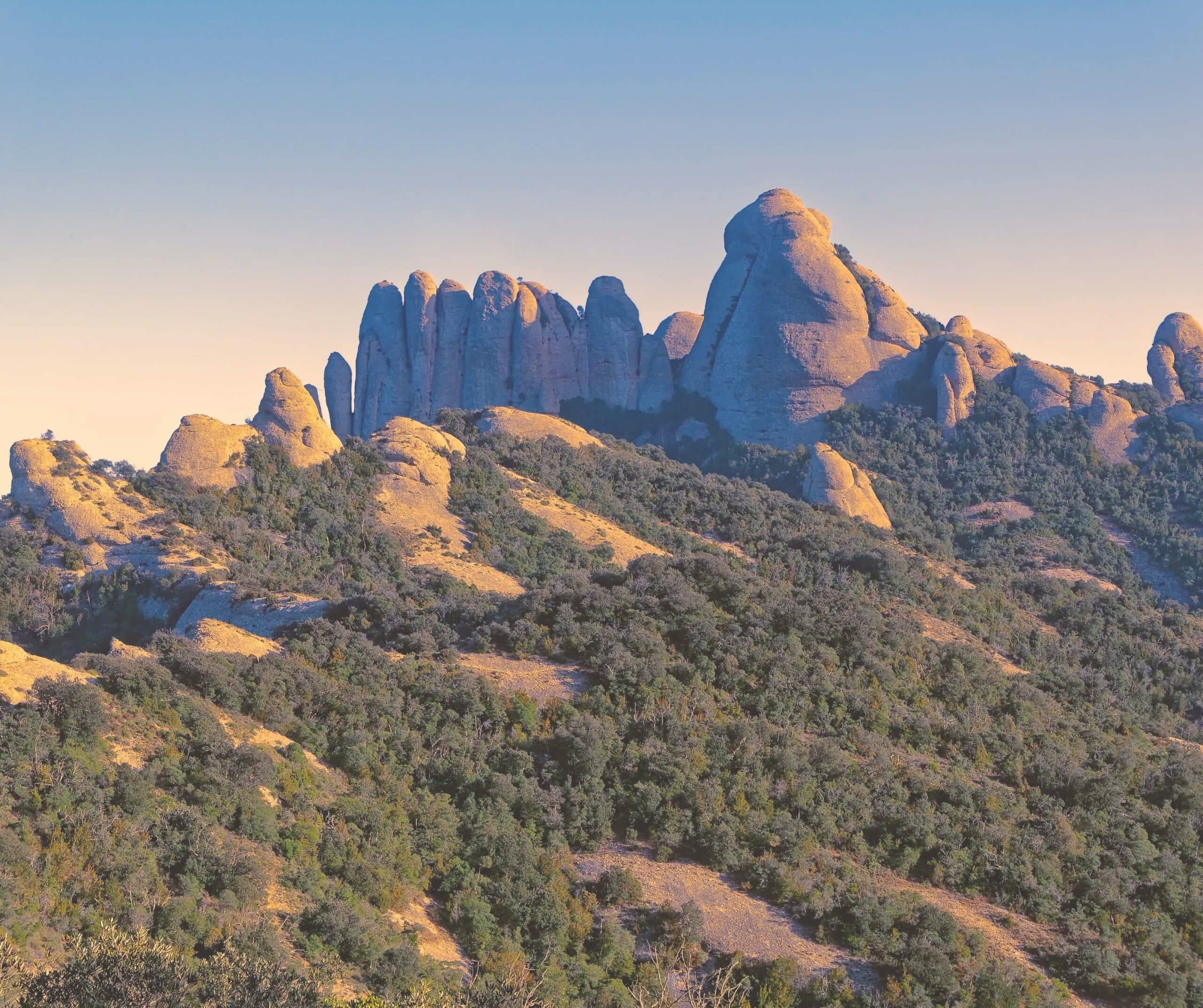 a view of montserrat at sunset