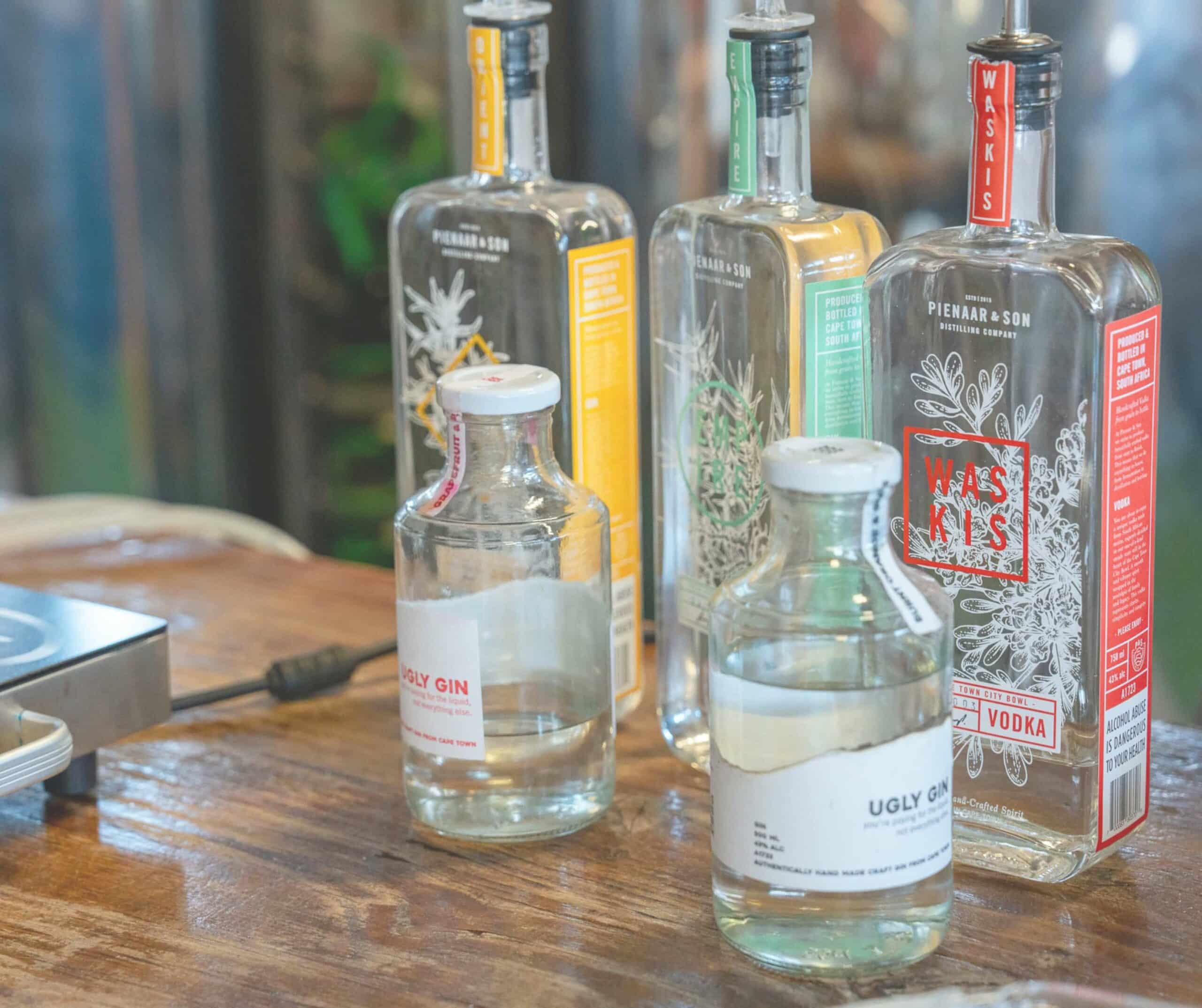 a group of clear bottles on a table