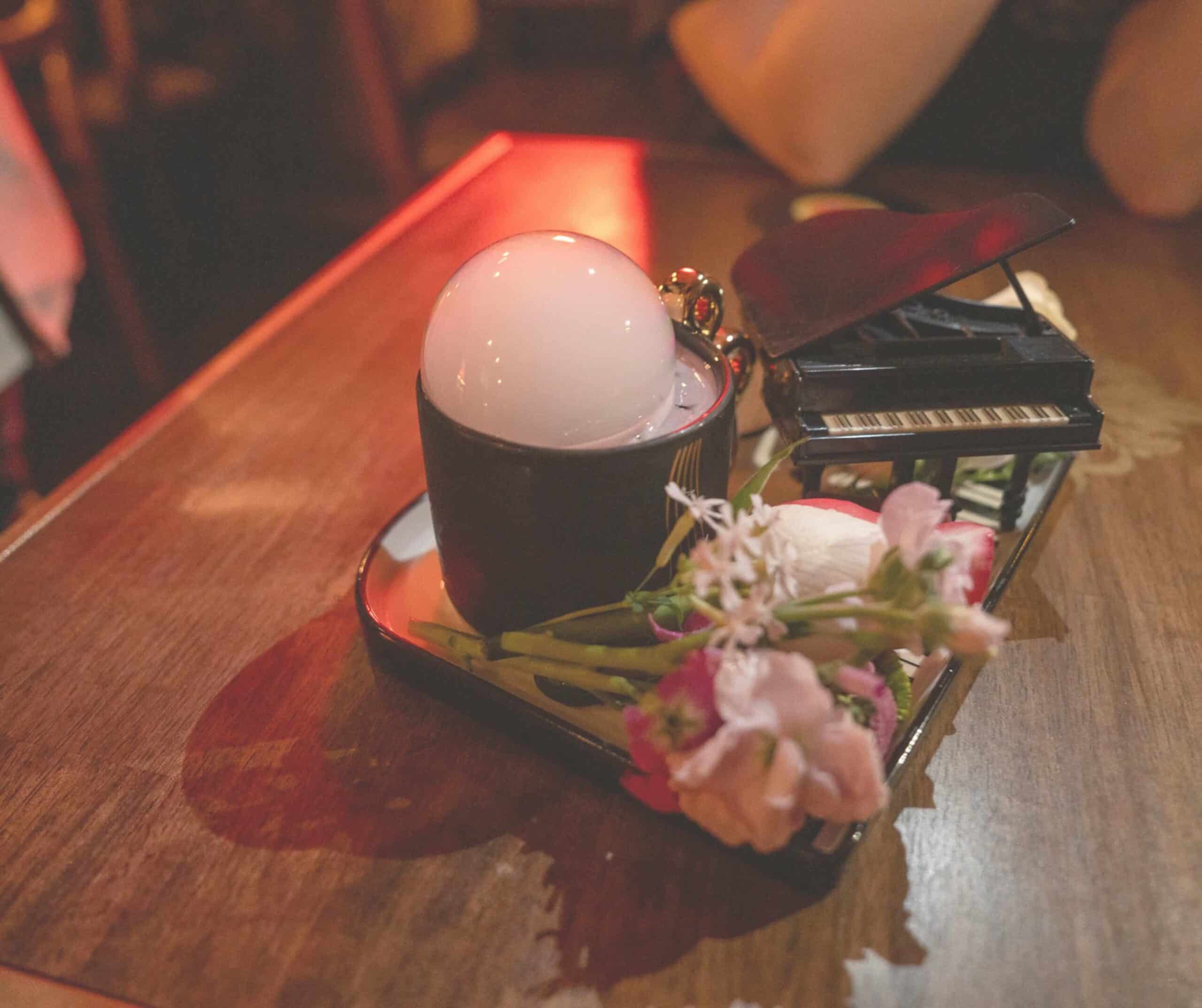 A prop-filled cocktail served in a guitar at Radio City, Seoul