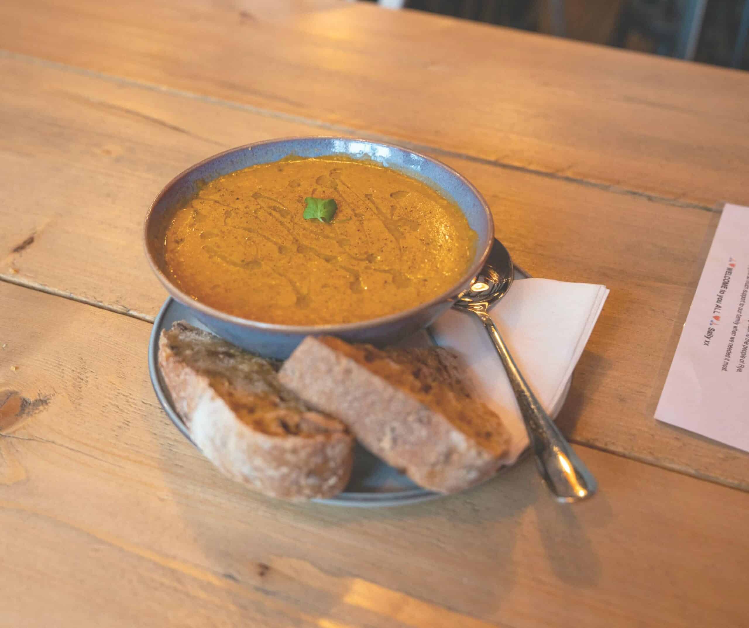Bowl of lentil soup with crusty bread at Grounded cafe in Rye