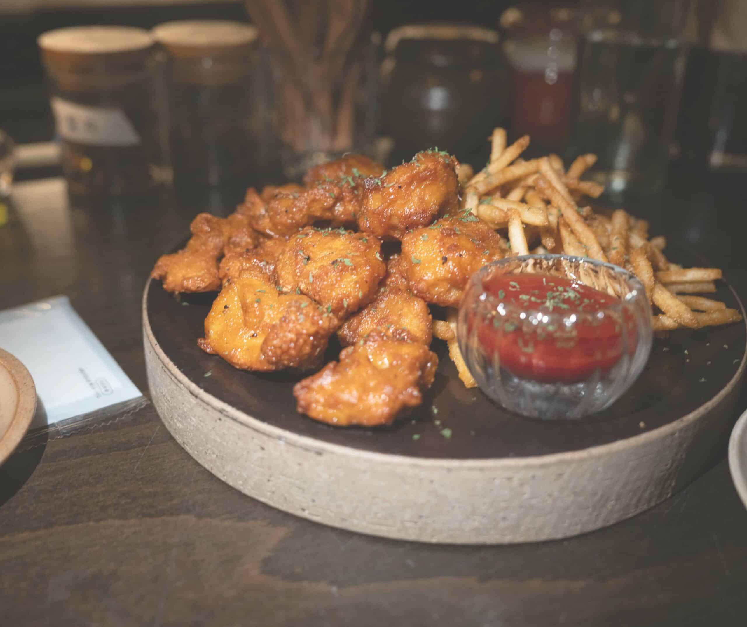 Crispy chicken karaage with truffle fries and dipping sauce at Ghiwon 22