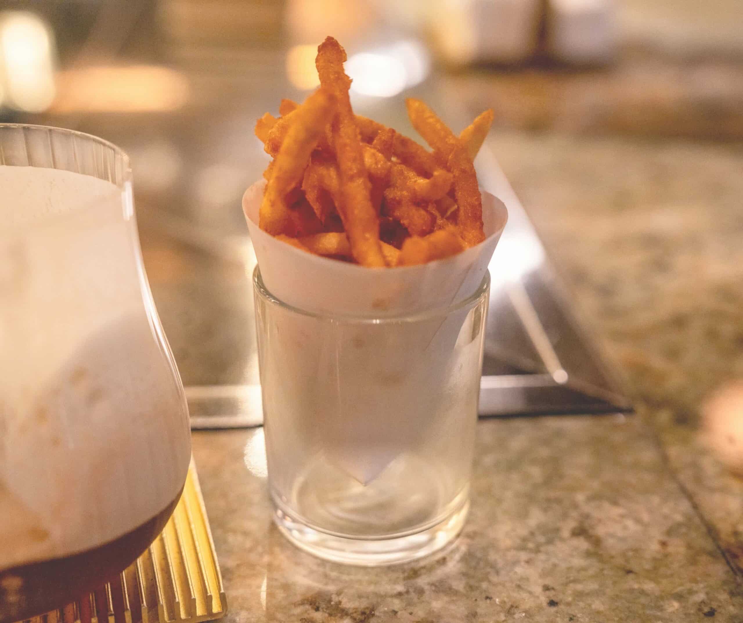 Truffle french fries served in a paper cone at Pussyfoot Saloon, Seoul