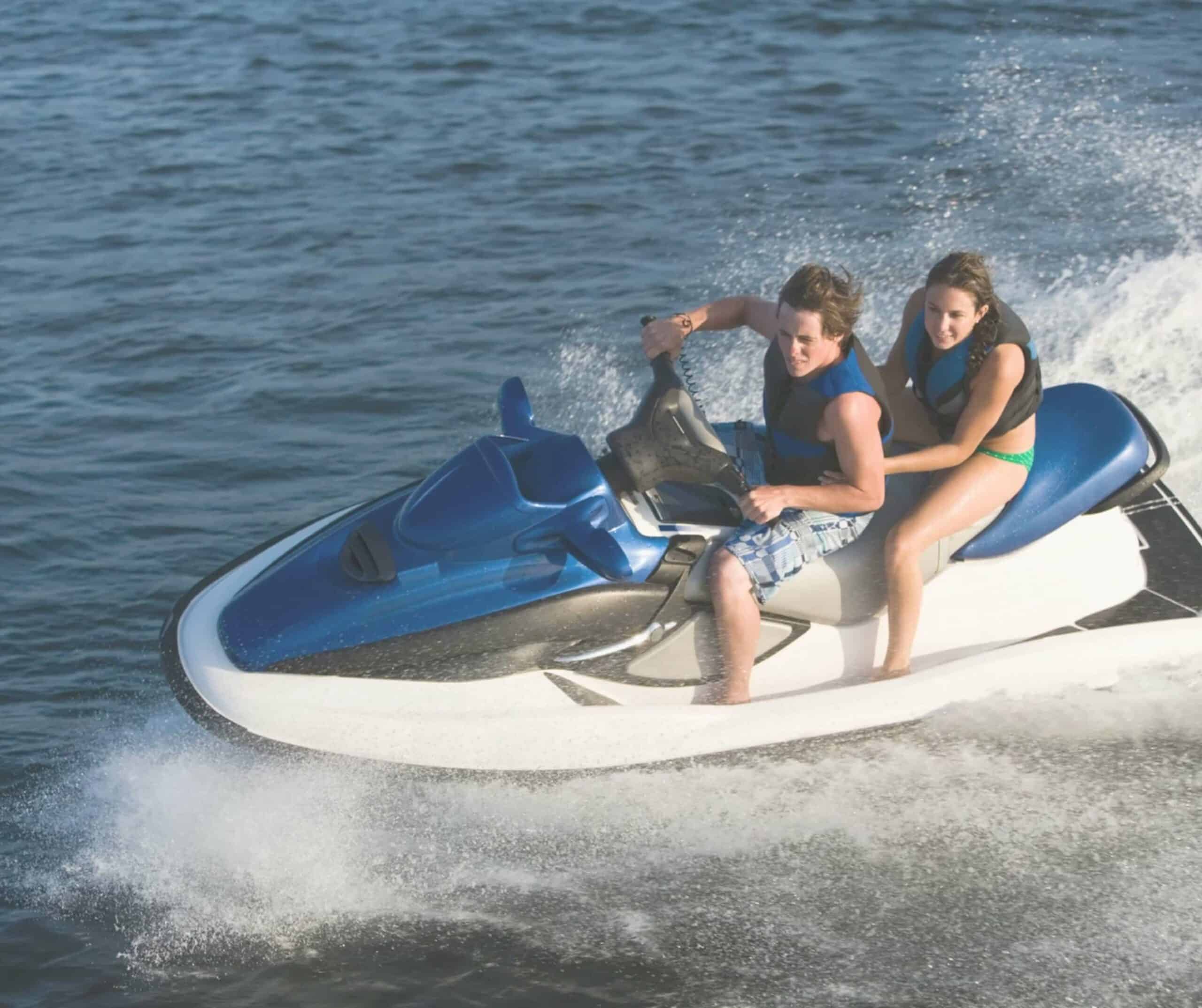Two riders in life vests sharing one jet ski at speed, like on a Corralejo to Lobos Island jet ski tour